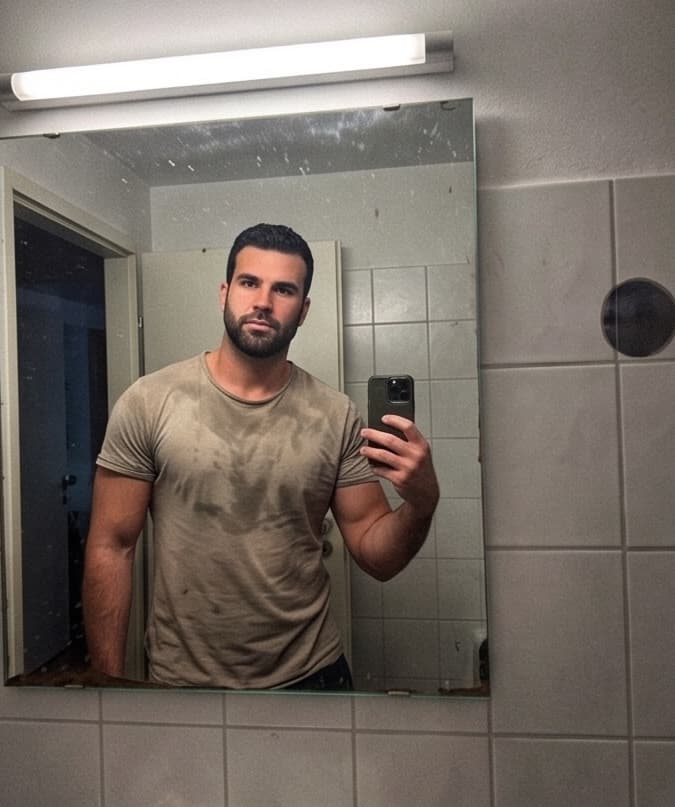 Bathroom mirror selfie under harsh light